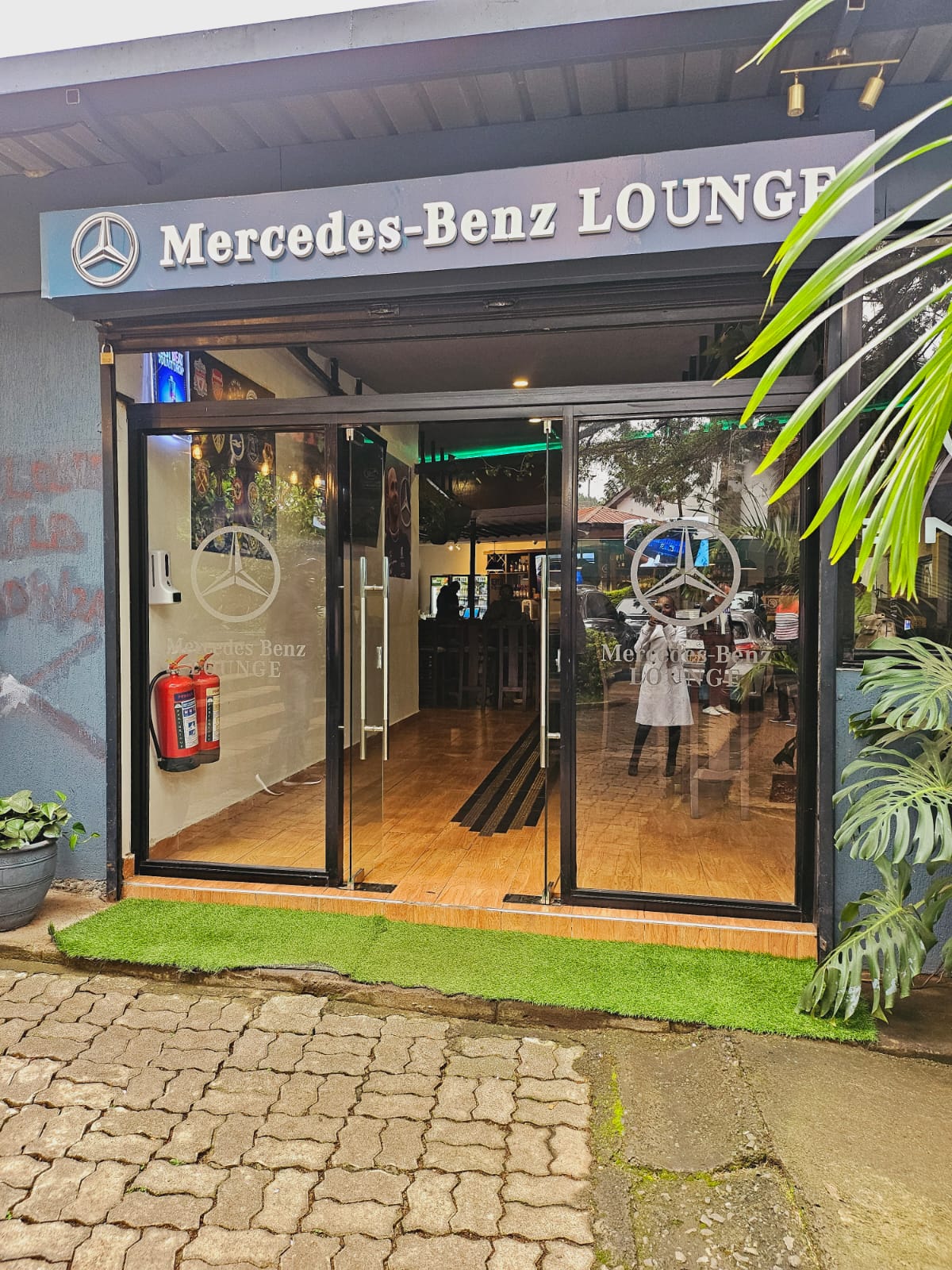 Illuminated Mercedes-Benz Lounge shopfront and glass branding