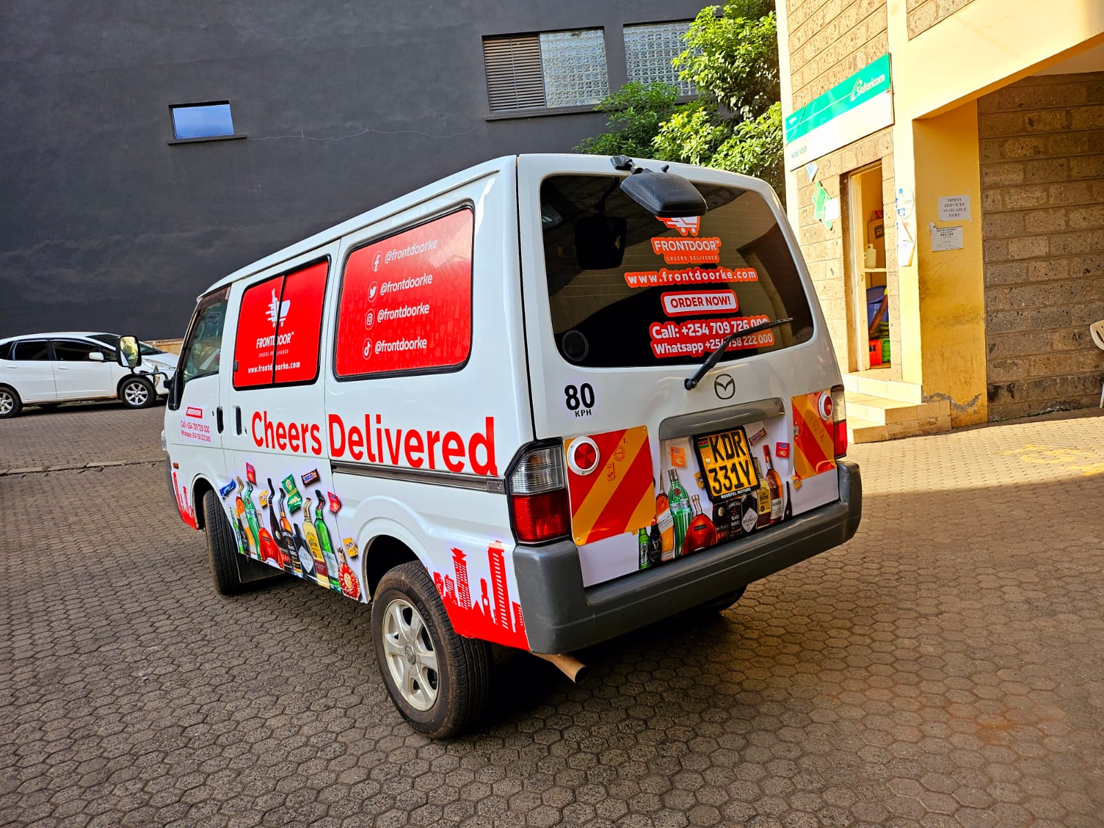 Front Door 'Cheers Delivered' branded delivery van